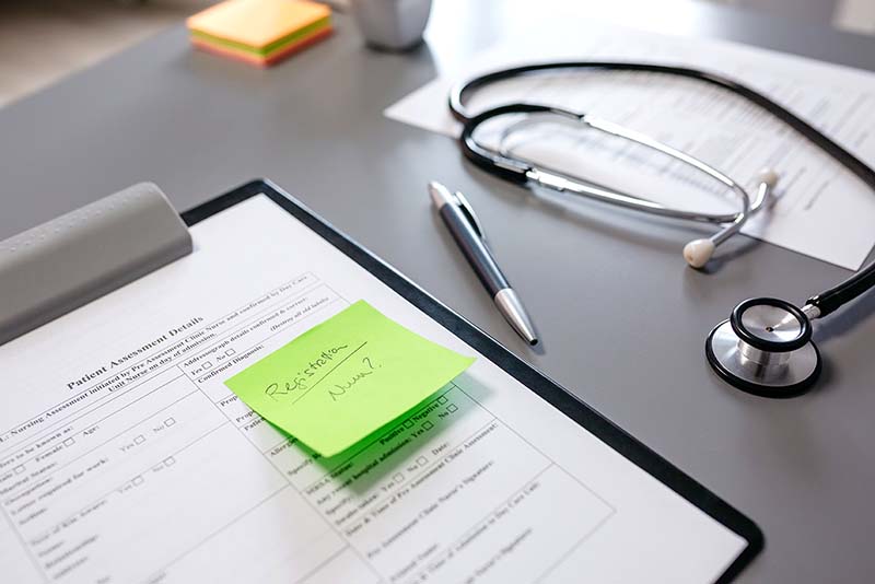 doctor desk with documents and stethoscope